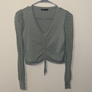 Sage green v neck crop top long sleeve size small. Sleeves are see through